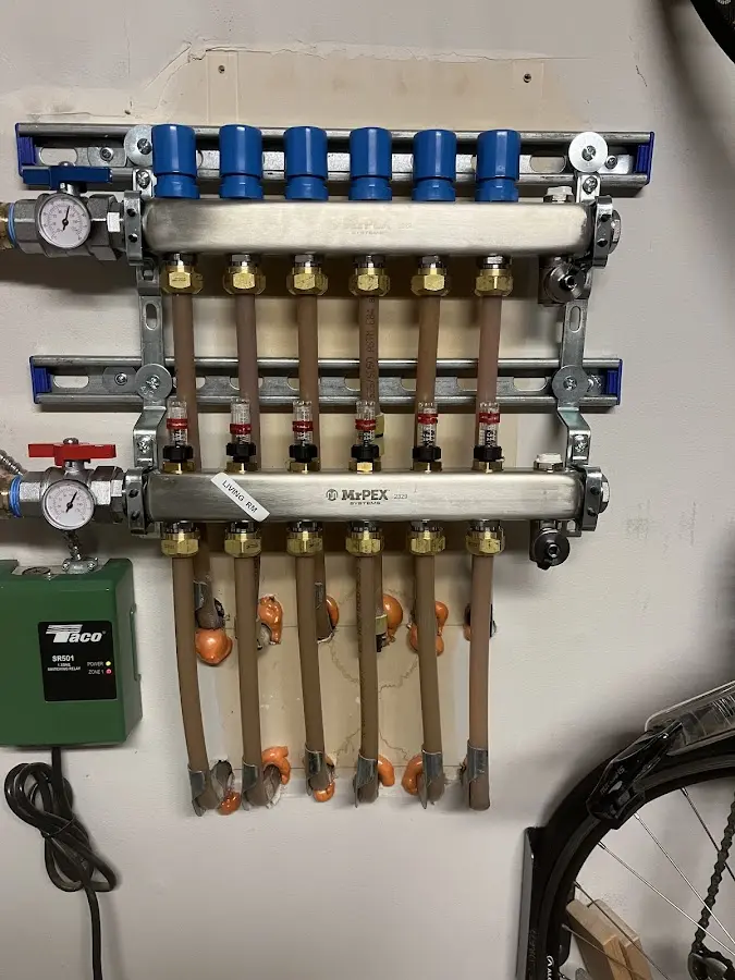 Plumber performing Water Heater Repair at a residential property in Cottage Lake